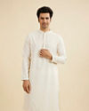 Warm White Self Textured Kurta Set with Embellished Neckline